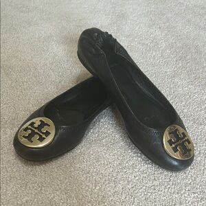 Tory Burch Black and Gold Flats with Iconic Medallion